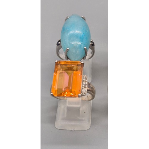 74 - A Collection of 10 Silver and Gem stone rings; Pink and Blue Quartz stones.