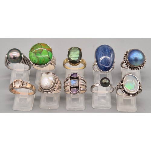 71 - A Collection of 10 Silver and Gem stone rings; Black pearl, Green hardstone, Opal and floral design,... 