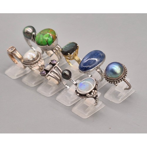71 - A Collection of 10 Silver and Gem stone rings; Black pearl, Green hardstone, Opal and floral design,... 