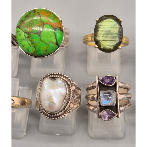 71 - A Collection of 10 Silver and Gem stone rings; Black pearl, Green hardstone, Opal and floral design,... 