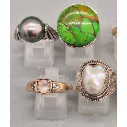 71 - A Collection of 10 Silver and Gem stone rings; Black pearl, Green hardstone, Opal and floral design,... 
