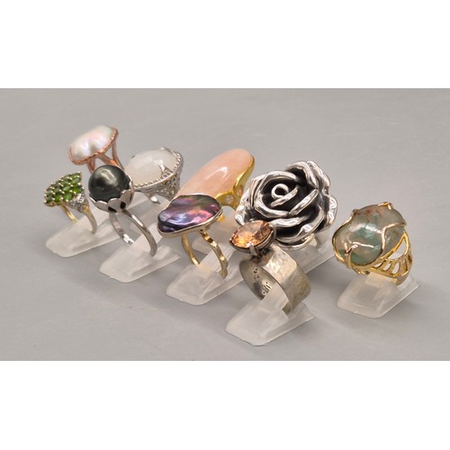 78 - A Collection of eight silver and gem stone rings; Statement silver floral ring. Silver and pink quar... 