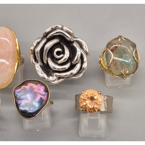 78 - A Collection of eight silver and gem stone rings; Statement silver floral ring. Silver and pink quar... 