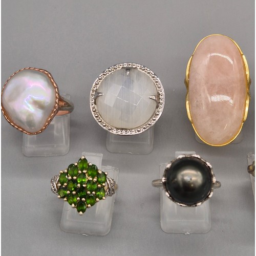 78 - A Collection of eight silver and gem stone rings; Statement silver floral ring. Silver and pink quar... 