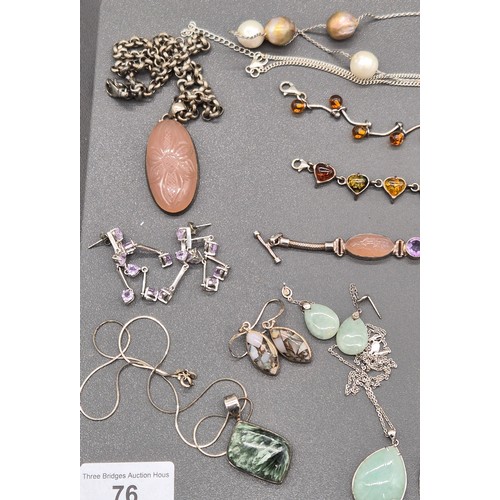 76 - A collection of silver jewellery; Silver and amber bracelets. Silver bracelet with t- bar and heart ... 