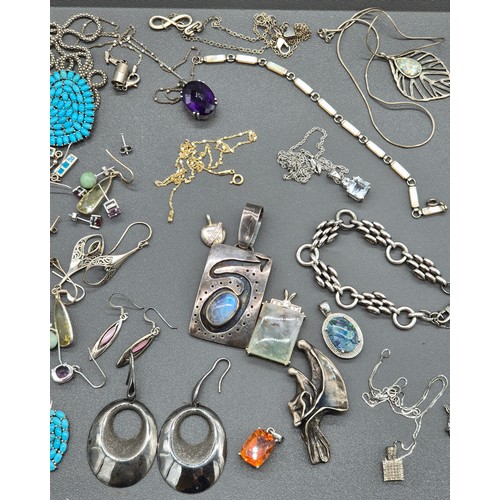 81 - A Collection of silver jewellery; Silver hand made rings and pendant. Silver and gem stone earrings.... 