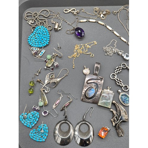 81 - A Collection of silver jewellery; Silver hand made rings and pendant. Silver and gem stone earrings.... 