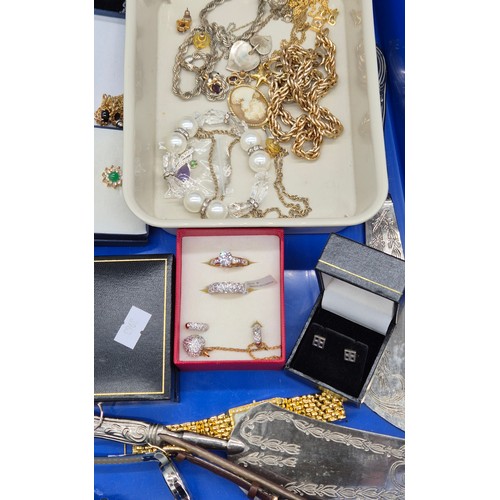 68 - Two trays of Costume jewellery; 9ct Gold Rabbit Charm. Various ladies watches. Rings, necklaces and ... 
