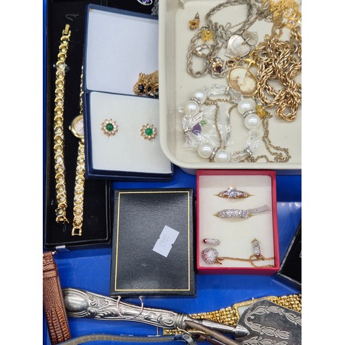 68 - Two trays of Costume jewellery; 9ct Gold Rabbit Charm. Various ladies watches. Rings, necklaces and ... 