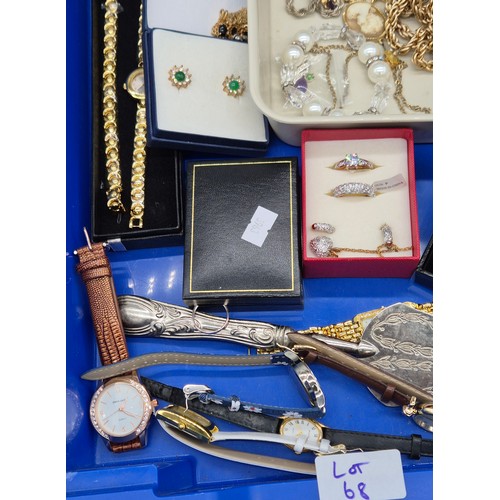 68 - Two trays of Costume jewellery; 9ct Gold Rabbit Charm. Various ladies watches. Rings, necklaces and ... 