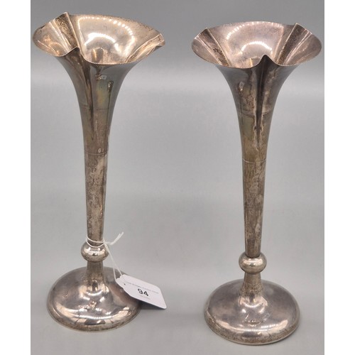 94 - A Pair of Weighted Chester Silver fluted bud vases. Produced by William Neale. 25.5cm high.