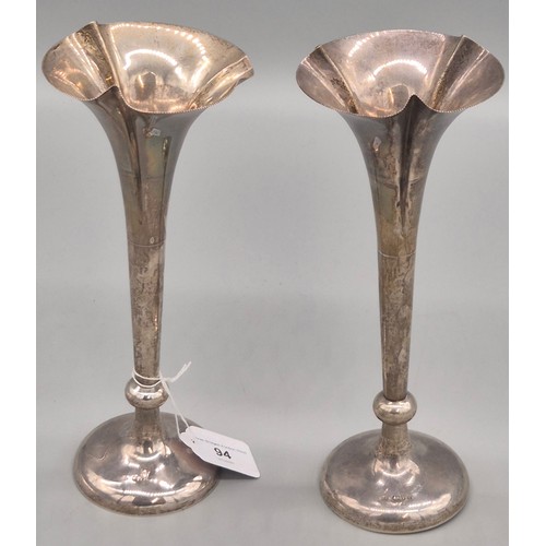 94 - A Pair of Weighted Chester Silver fluted bud vases. Produced by William Neale. 25.5cm high.