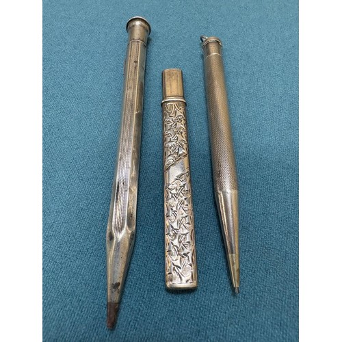 102A - Three Silver items; Birmingham silver needle holder. 830 silver pencil and London Silver revolving p... 