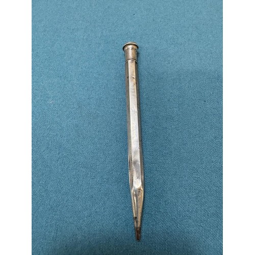 102A - Three Silver items; Birmingham silver needle holder. 830 silver pencil and London Silver revolving p... 