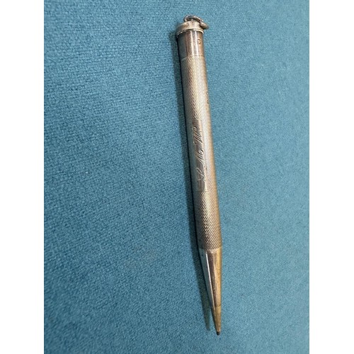 102A - Three Silver items; Birmingham silver needle holder. 830 silver pencil and London Silver revolving p... 