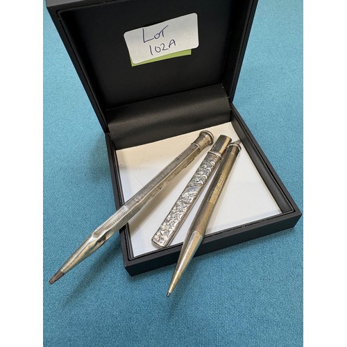 102A - Three Silver items; Birmingham silver needle holder. 830 silver pencil and London Silver revolving p... 