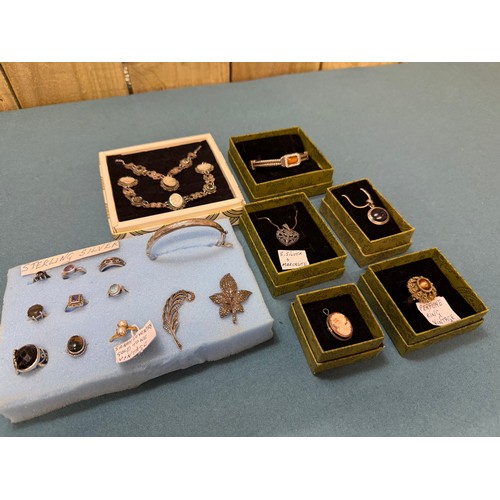103A - A tray of silver and costume jewellery; Various Art Deco silver rings. Silver bangle. Silver and mar... 