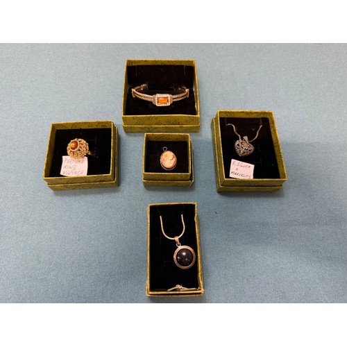 103A - A tray of silver and costume jewellery; Various Art Deco silver rings. Silver bangle. Silver and mar... 