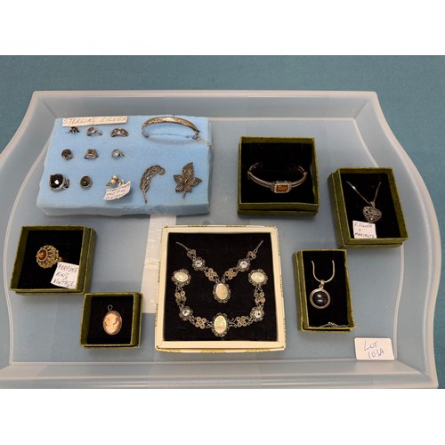 103A - A tray of silver and costume jewellery; Various Art Deco silver rings. Silver bangle. Silver and mar... 