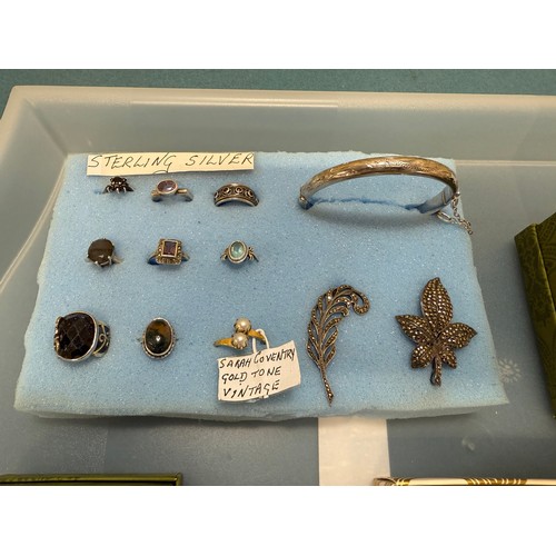 103A - A tray of silver and costume jewellery; Various Art Deco silver rings. Silver bangle. Silver and mar... 