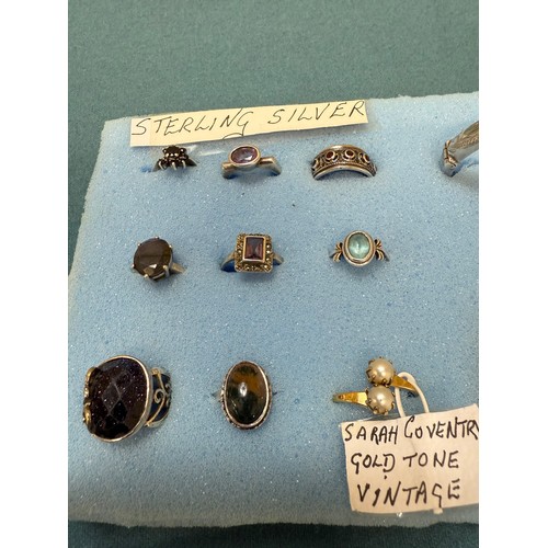 103A - A tray of silver and costume jewellery; Various Art Deco silver rings. Silver bangle. Silver and mar... 