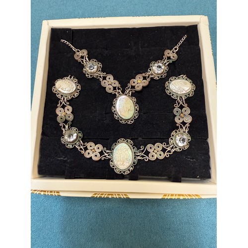 103A - A tray of silver and costume jewellery; Various Art Deco silver rings. Silver bangle. Silver and mar... 