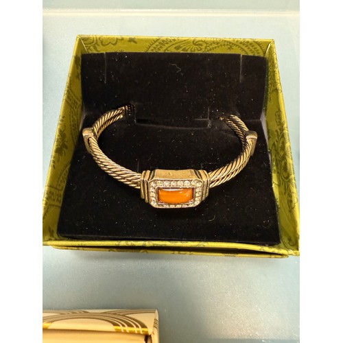 103A - A tray of silver and costume jewellery; Various Art Deco silver rings. Silver bangle. Silver and mar... 