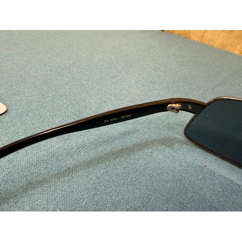 105A - A Vintage pair of Ray Ban Sunglasses. Comes with protective case.