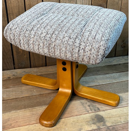 Contemporary material relaxer chair with matching foot stool.