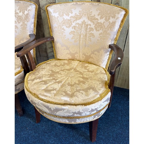 246 - Pair of vintage bedroom arm chairs. Gilt trim upholstery. Raised on shaped legs.