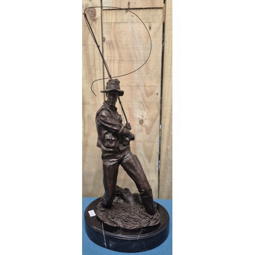 250 - Bronze Fisherman Sculpture Raised on a marble base. 24cm high- measured to hat.