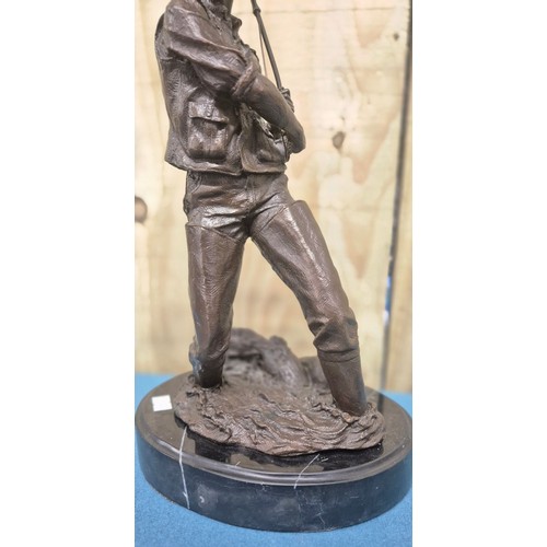 250 - Bronze Fisherman Sculpture Raised on a marble base. 24cm high- measured to hat.