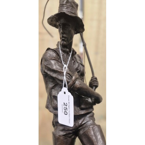 250 - Bronze Fisherman Sculpture Raised on a marble base. 24cm high- measured to hat.