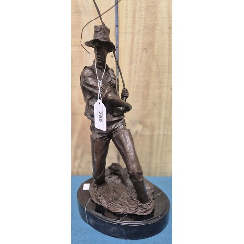 250 - Bronze Fisherman Sculpture Raised on a marble base. 24cm high- measured to hat.