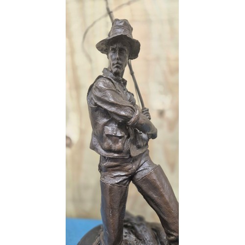 250 - Bronze Fisherman Sculpture Raised on a marble base. 24cm high- measured to hat.