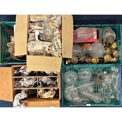 502 - Three Crates  & Two boxes of Oil lamps funnels, Brass fittings & other items.