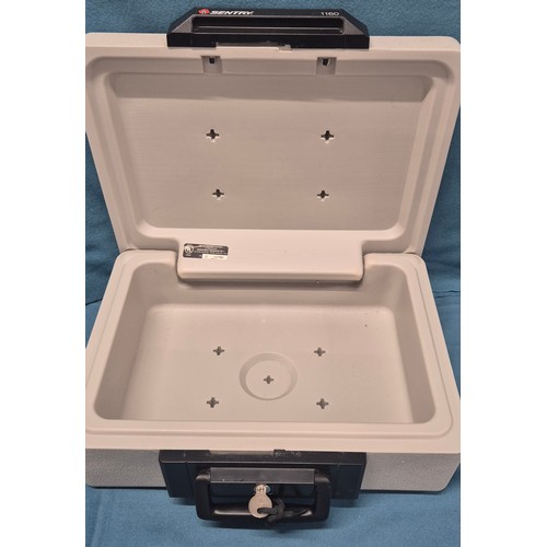 598 - Sentry 1160 Portable safe and key.