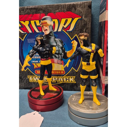 575 - Three X-Men statues; Ultimate X-Men Cyclops Ultimate Bust with box and X-Men Cyclops mini statues tw... 