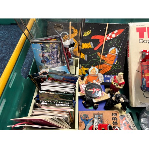 591 - A Crate of Tin Tin Collectables and odds; Card deck containing mixed collectors cards- Simpsons, Sta... 