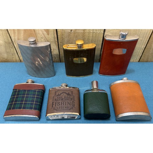 190 - A Collection of vintage whisky flasks.