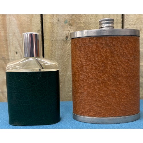 190 - A Collection of vintage whisky flasks.