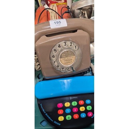 195 - Four vintage dial phones and push button phones. Also includes Dandy books.