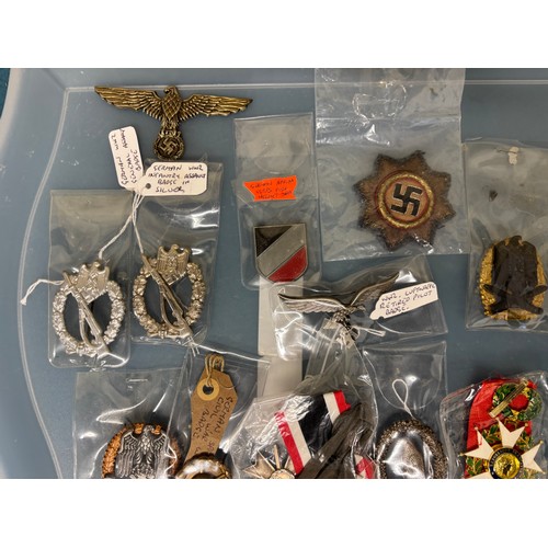 225 - A Tray containing a collection of German Military badges; WW2 German wound badge, WW2 Luftwaffe reti... 