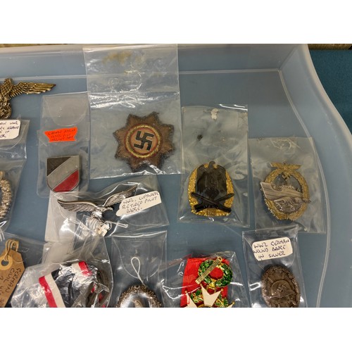 225 - A Tray containing a collection of German Military badges; WW2 German wound badge, WW2 Luftwaffe reti... 