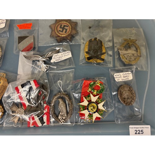 225 - A Tray containing a collection of German Military badges; WW2 German wound badge, WW2 Luftwaffe reti... 