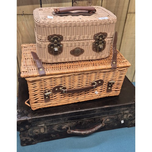 272 - Antique leather travel case, picnic basket with contents and Monarch wine basket with two glasses.