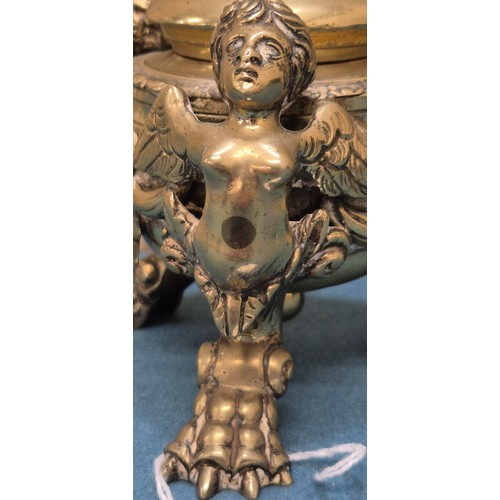 284 - Antique heavy brass ink well pot; Lid designed with an eagle finial. Body detailed with three cherub... 