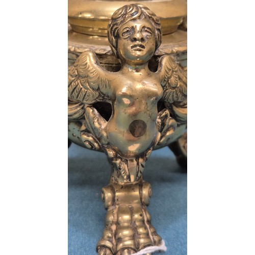 284 - Antique heavy brass ink well pot; Lid designed with an eagle finial. Body detailed with three cherub... 