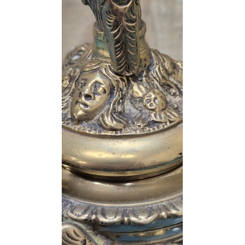 284 - Antique heavy brass ink well pot; Lid designed with an eagle finial. Body detailed with three cherub... 