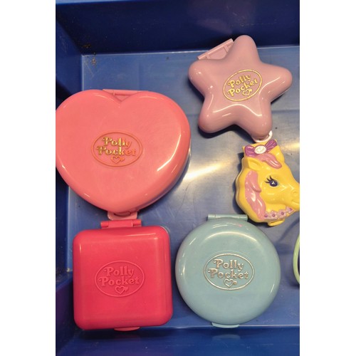 303 - Four trays of Polly pocket play sets and figures.